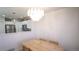 Light-filled dining area with wood table and chandelier at 2245 E 103Rd Pl, Thornton, CO 80229