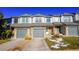 Attractive townhome with gray siding and a welcoming front porch at 2245 E 103Rd Pl, Thornton, CO 80229