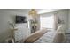 Main bedroom with white dresser, king bed, and large window at 2245 E 103Rd Pl, Thornton, CO 80229