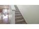 Carpeted staircase leading to the upper level at 2245 E 103Rd Pl, Thornton, CO 80229