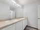 Double vanity bathroom with beige countertop and gray flooring at 10288 Salida St, Commerce City, CO 80022