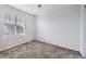 Cozy bedroom with window for natural light and plush carpeting at 10288 Salida St, Commerce City, CO 80022