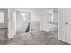 Bright hallway with neutral carpet and natural light from the window near the staircase at 10288 Salida St, Commerce City, CO 80022