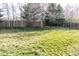 Spacious backyard with lush green grass and a wooden fence is perfect for outdoor activities at 17020 W 64Th Dr, Arvada, CO 80007