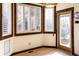 Cozy breakfast nook filled with natural light, wood floors, and shutters for privacy at 17020 W 64Th Dr, Arvada, CO 80007