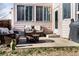 Inviting backyard patio with comfortable seating, a fire pit, and outdoor grill for entertaining at 17020 W 64Th Dr, Arvada, CO 80007