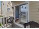Balcony has two chairs with sliding door entrance at 1771 W 53Rd Pl # 1, Denver, CO 80221