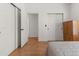 Bedroom features include wood floors and white closets at 1771 W 53Rd Pl # 1, Denver, CO 80221