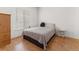 Cozy bedroom with hardwood floors, natural light, and a simple, comfortable style at 1771 W 53Rd Pl # 1, Denver, CO 80221