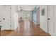 Open-concept layout with hardwood floors, a sliding glass door, and a view into the living space at 1771 W 53Rd Pl # 1, Denver, CO 80221