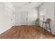 Living room featuring hardwood floors, neutral colors, and a window for natural light at 1771 W 53Rd Pl # 1, Denver, CO 80221
