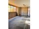 Unfinished basement with concrete floors, cinder block walls, and natural light from the window at 500 30Th St # 5, Denver, CO 80205