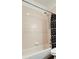 Clean bathroom showcasing a tub with white subway tile and shower head with a modern shower curtain at 500 30Th St # 5, Denver, CO 80205