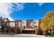 Modern townhome with a blend of brick and stucco exterior, offering a two-car garage and tidy landscaping at 500 30Th St # 5, Denver, CO 80205