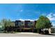 Attractive townhome with brick and stucco facade, private entrances, and green landscaping at 500 30Th St # 5, Denver, CO 80205
