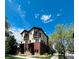 Charming townhome with balconies, brick accents, and a well-maintained lawn at 500 30Th St # 5, Denver, CO 80205