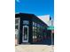Street view of a commercial building featuring a black exterior, corner location, and 30th street sign at 500 30Th St # 5, Denver, CO 80205