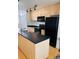 Efficient kitchen with stainless steel appliances, dark countertops, and modern cabinetry at 500 30Th St # 5, Denver, CO 80205