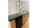 Kitchen featuring stylish black appliances, dark countertops and contemporary backsplash at 500 30Th St # 5, Denver, CO 80205