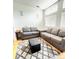 Bright living room featuring hardwood floors, modern furniture, and natural light at 500 30Th St # 5, Denver, CO 80205