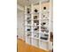 Unique shelving unit adds visual interest to the interior with displayed plants and minimalist design at 500 30Th St # 5, Denver, CO 80205
