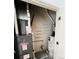 Utility room featuring furnace and water heater, along with a wire shelving unit at 500 30Th St # 5, Denver, CO 80205