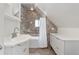 Updated bathroom with tiled shower and vanity at 2829 N Franklin St, Denver, CO 80205