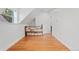 Spacious bedroom with hardwood floors, a window, and a built-in bookshelf at 2829 N Franklin St, Denver, CO 80205