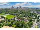 Aerial view showcasing the property's location with the downtown Denver skyline in the background at 2829 N Franklin St, Denver, CO 80205