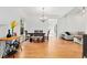 Bright dining area with hardwood floors and modern chandelier that flows into the living space at 2829 N Franklin St, Denver, CO 80205