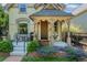 Charming front porch with swing, seating area, and lovely landscaping enhancing curb appeal at 2829 N Franklin St, Denver, CO 80205