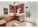 Well-lit kitchen featuring granite countertops, stainless steel appliances, and stylish cabinetry at 2829 N Franklin St, Denver, CO 80205