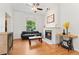Inviting living room with a cozy fireplace, hardwood floors, and stylish decor at 2829 N Franklin St, Denver, CO 80205