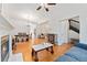 Open-concept living space with hardwood floors, fireplace, dining area, and modern furnishings at 2829 N Franklin St, Denver, CO 80205