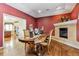 Charming dining room with a fireplace, perfect for hosting dinner parties with friends and Gathering at 3860 S Elkhart St, Aurora, CO 80014