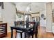 Well-lit dining room with an open concept leading into the kitchen area at 3860 S Elkhart St, Aurora, CO 80014