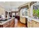 Spacious kitchen featuring a large island, stainless steel appliances, and hardwood floors at 3860 S Elkhart St, Aurora, CO 80014