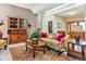 Inviting living room featuring a comfortable sofa, bookcase, and natural wood accents at 3860 S Elkhart St, Aurora, CO 80014