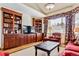 Cozy living room with built-in bookcases and a large window at 3860 S Elkhart St, Aurora, CO 80014