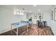 Spacious basement offers a ping pong table, bar seating, and stylish decor at 2836 Cherry St, Denver, CO 80207