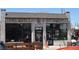 Long Table Brewhouse exterior featuring exposed brick and large windows at 2836 Cherry St, Denver, CO 80207