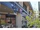 Modern commercial building with various business signage and ample windows at 2836 Cherry St, Denver, CO 80207