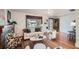 Cozy living room showcasing a decorative fireplace, large window, and comfortable seating area with hardwood floors at 2836 Cherry St, Denver, CO 80207