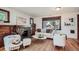 Cozy living room with a stone fireplace, hardwood floors, and comfortable seating arrangement at 2836 Cherry St, Denver, CO 80207