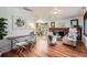 Open-concept living room featuring hardwood floors, stylish decor, and ample natural light at 2836 Cherry St, Denver, CO 80207