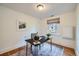 Home office featuring hardwood floors, a desk, natural light from the window, and stylish decor at 2836 Cherry St, Denver, CO 80207