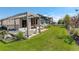 Beautiful backyard with lush green lawn, stylish patio furniture, and a covered patio area at 3436 W 154Th Ave, Broomfield, CO 80023