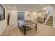 Finished basement with ping pong table, bar, and staircase at 3436 W 154Th Ave, Broomfield, CO 80023