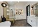 Bathroom with glass enclosed shower, double sink vanities, and modern lighting at 3436 W 154Th Ave, Broomfield, CO 80023