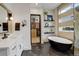 Spa-like bathroom features a soaking tub, sleek fixtures, and a view into walk-in closet at 3436 W 154Th Ave, Broomfield, CO 80023